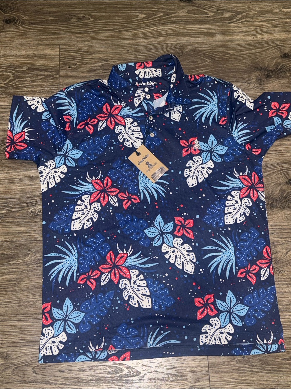 chubbies Navy Tropical Floral Polo with Red & Light Blue Accents
